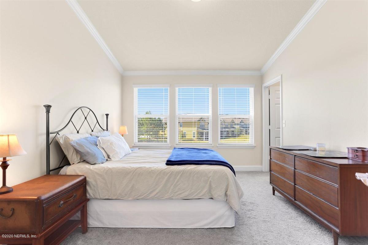 6864 Roundleaf Drive Jacksonville, FL 32258 - Photo 10 of 17 a bedroom with a bed and window