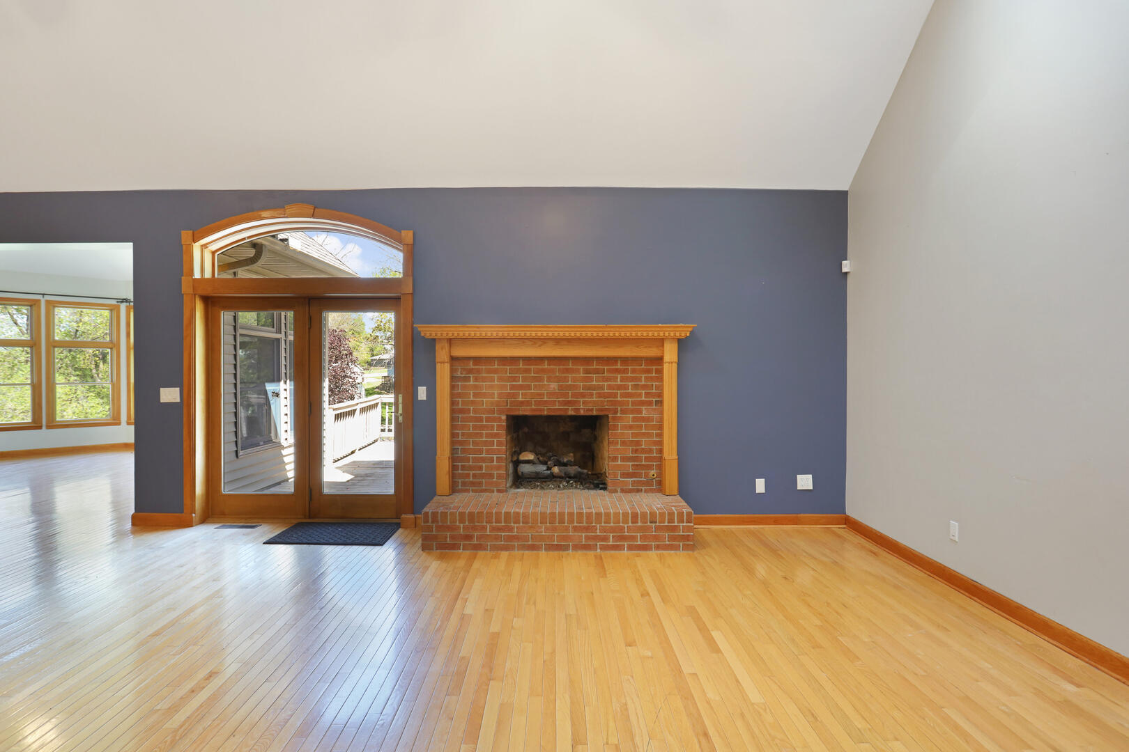 408 South Spring Lake Road Mahomet, IL 61853 - Photo 13 of 64 a view of an empty room with window and wooden floor