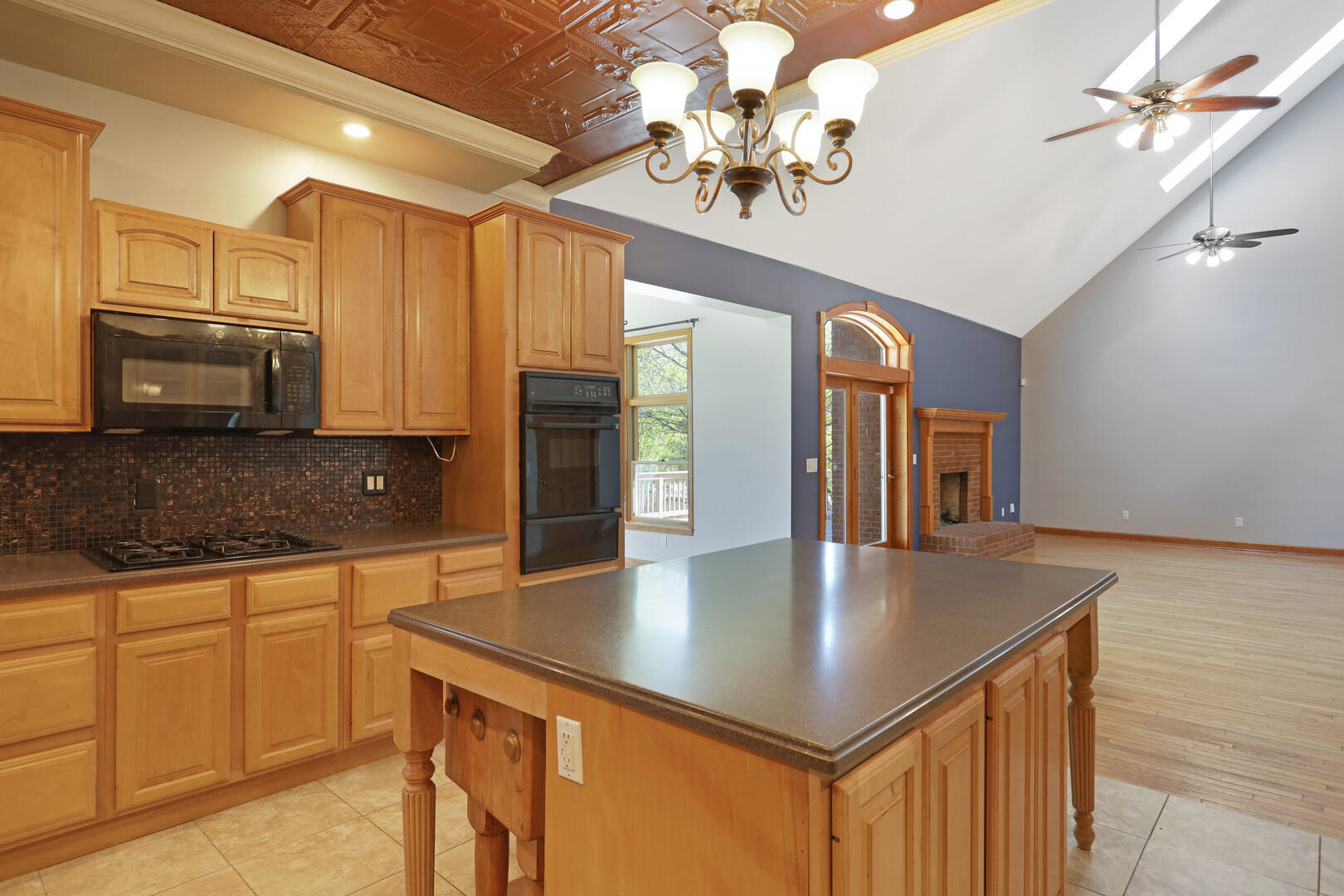 408 South Spring Lake Road Mahomet, IL 61853 - Photo 18 of 64 a kitchen with stainless steel appliances granite countertop a sink window and cabinets