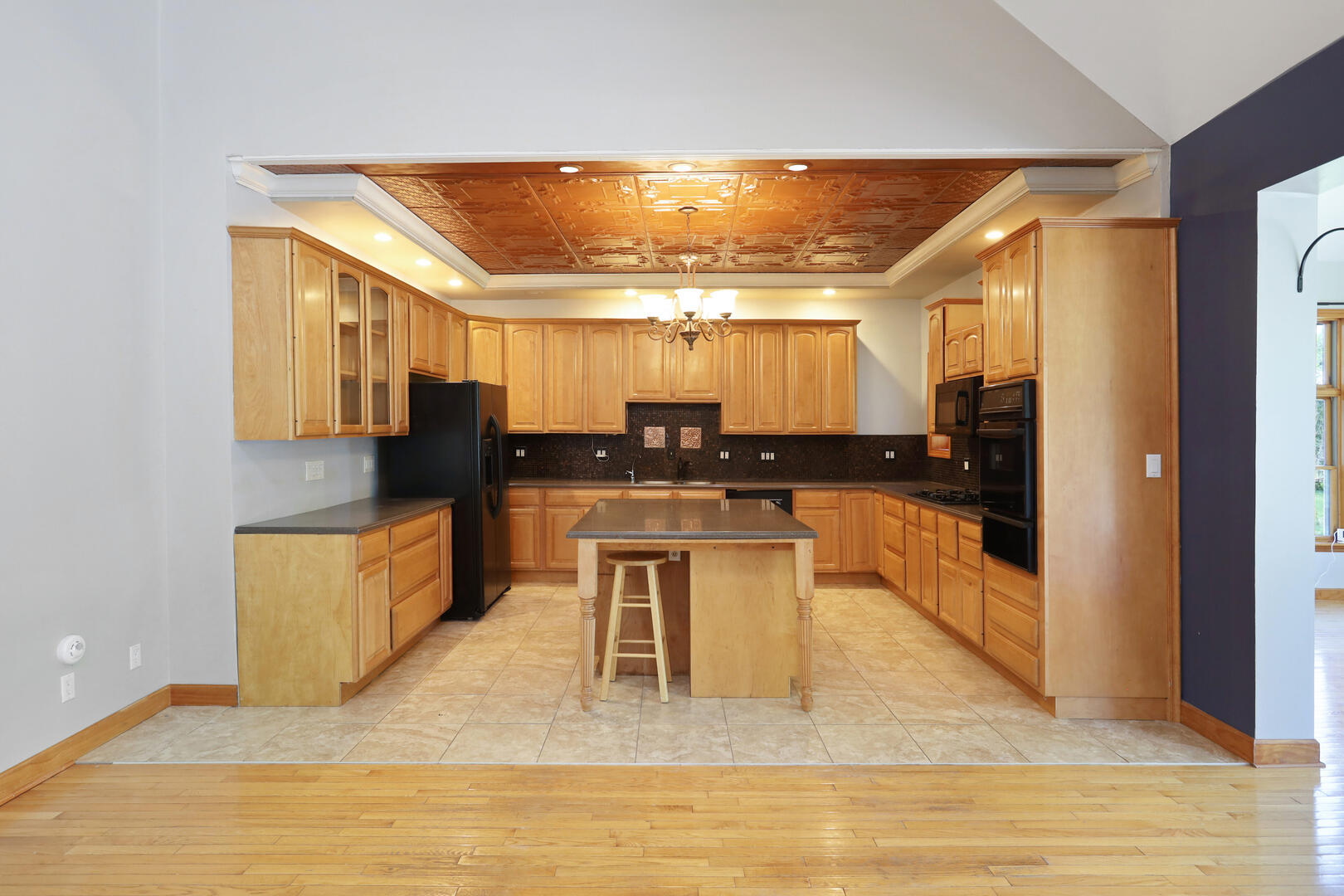 408 South Spring Lake Road Mahomet, IL 61853 - Photo 19 of 64 a kitchen with stainless steel appliances kitchen island granite countertop a stove and a sink