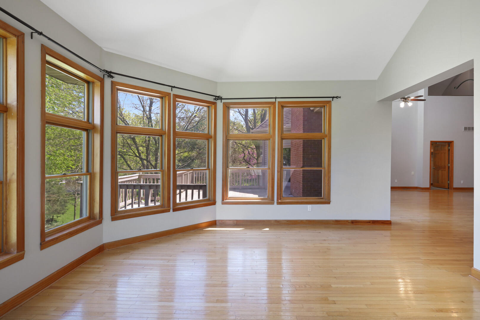 408 South Spring Lake Road Mahomet, IL 61853 - Photo 21 of 64 a view of an empty room with wooden floor and a window