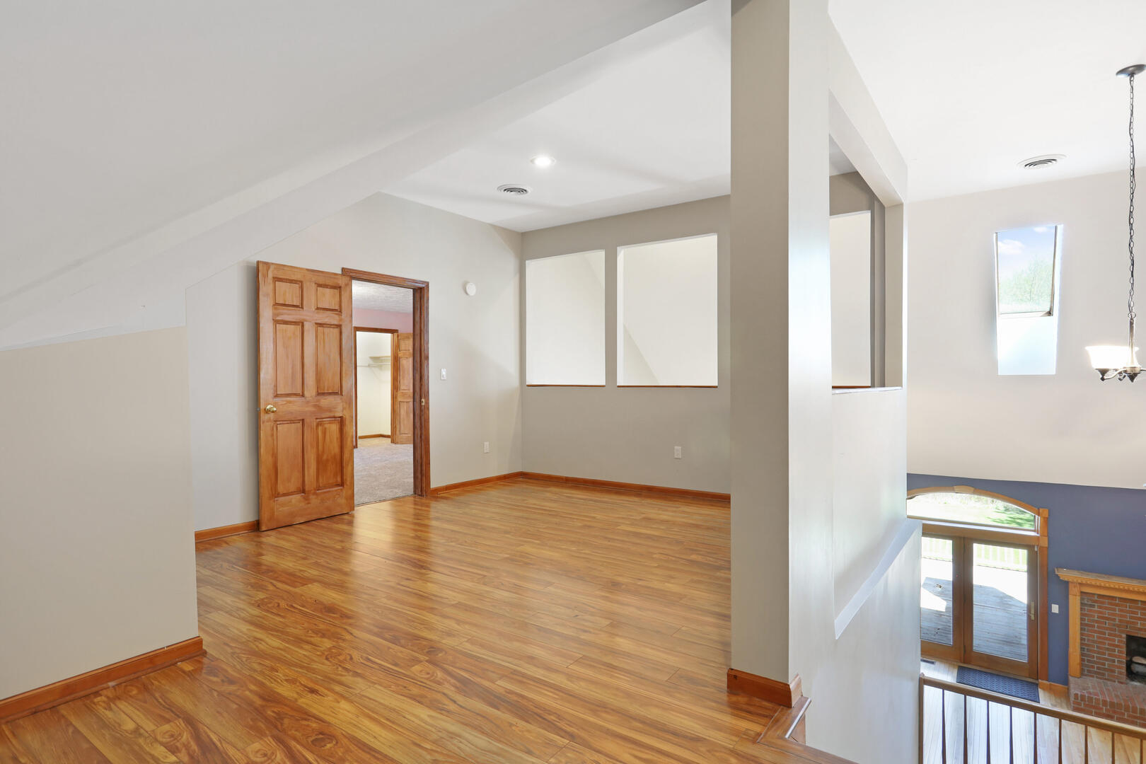 408 South Spring Lake Road Mahomet, IL 61853 - Photo 43 of 64 a view of an empty room with window and wooden floor