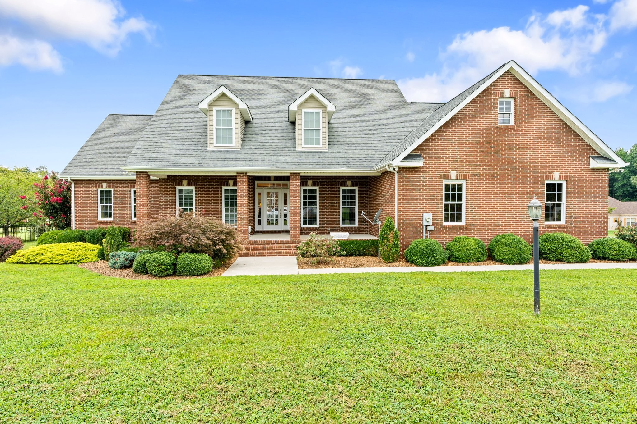 545 Pickney Road Winchester, TN 37398 - Photo 2 of 39 a front view of a house with a yard and garage