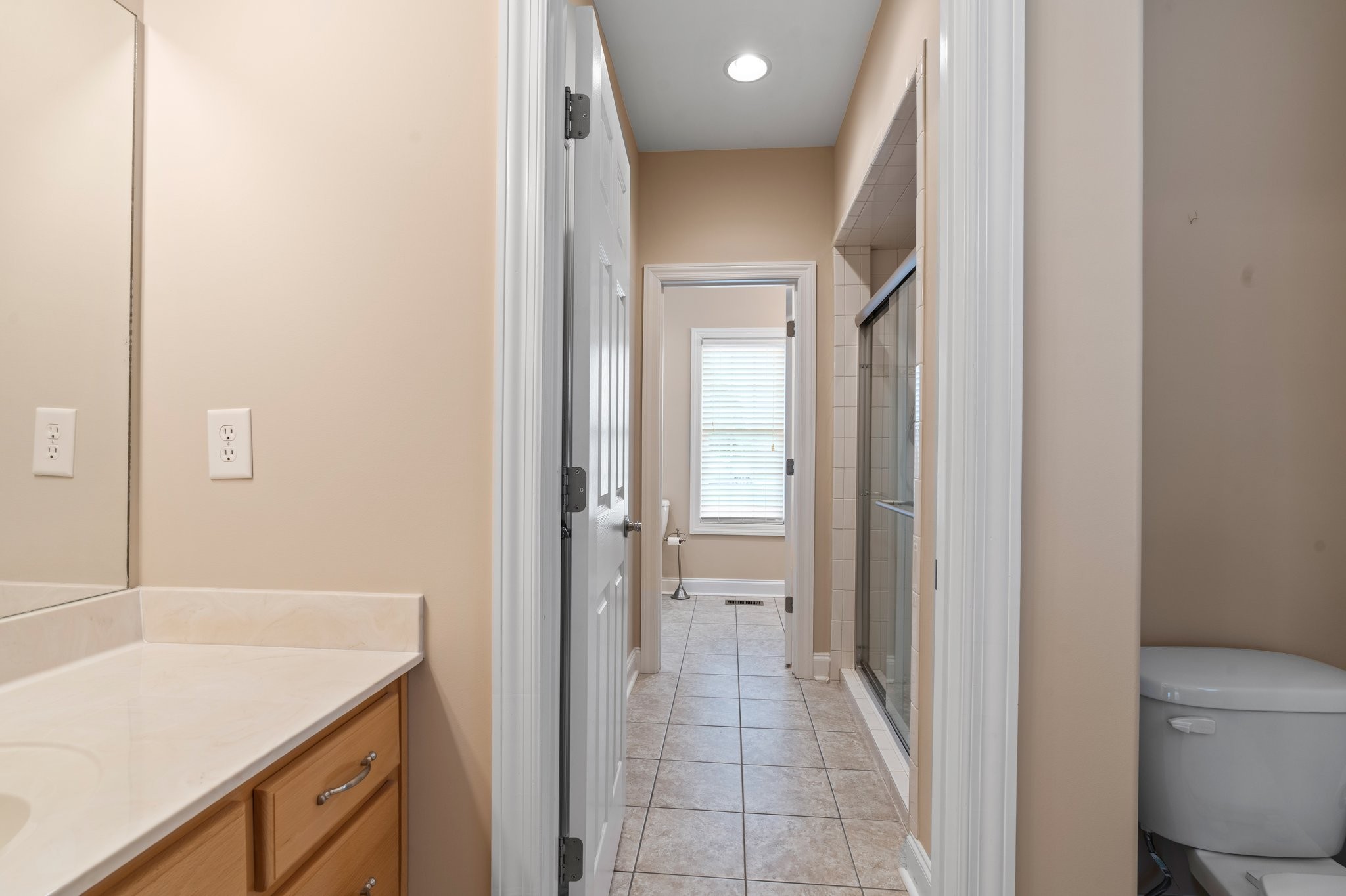 545 Pickney Road Winchester, TN 37398 - Photo 27 of 39 a bathroom with a granite countertop sink a mirror and a bathtub