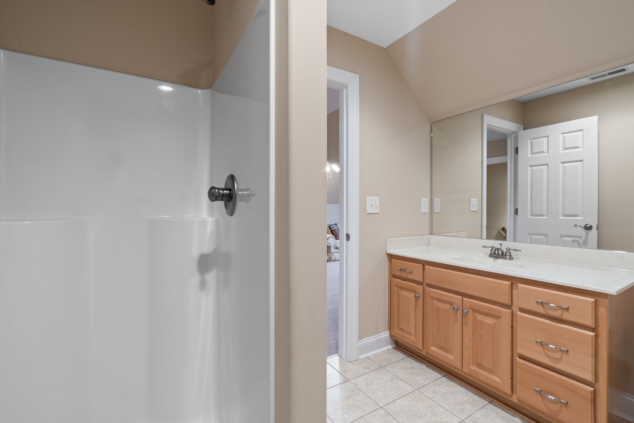 545 Pickney Road Winchester, TN 37398 - Photo 36 of 39 a bathroom with a granite countertop sink a mirror and a shower