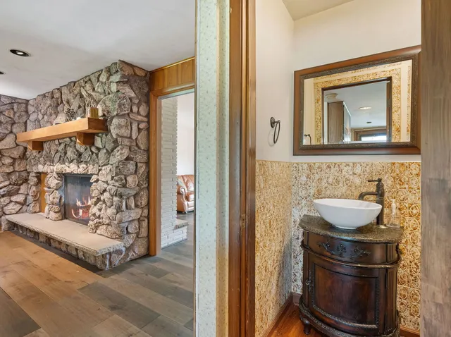 a bathroom with a sink and a mirror