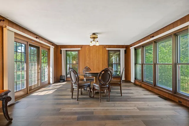 a view of a dining room with furniture window and outside view