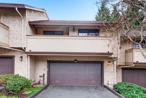 a front view of a house with a garage
