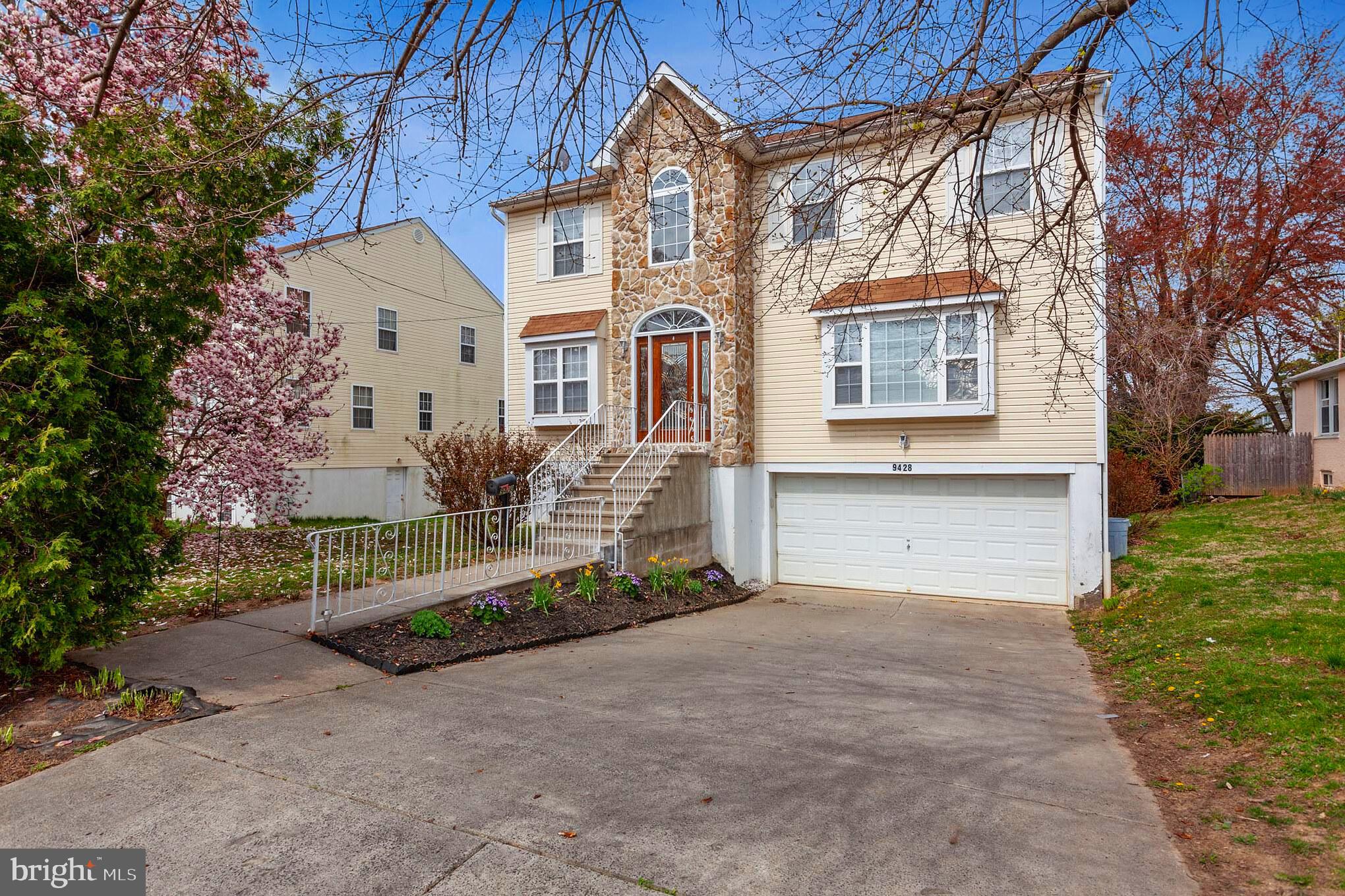 9428 Krewstown Road Philadelphia, PA 19115 - Photo 1 of 30 a front view of a house with garden