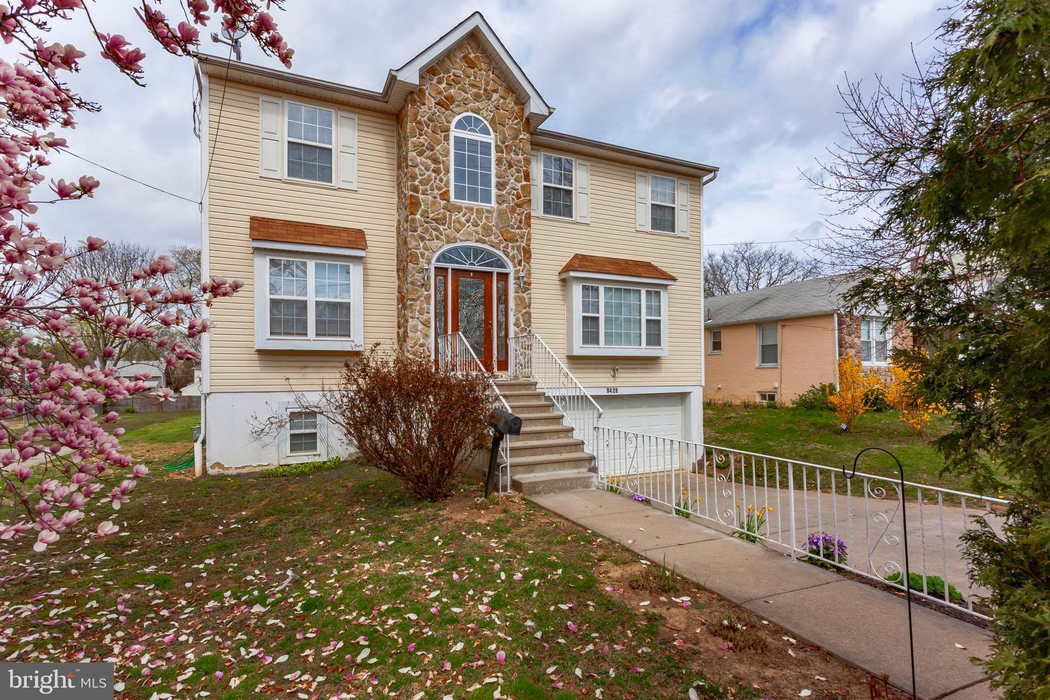 9428 Krewstown Road Philadelphia, PA 19115 - Photo 2 of 30 a front view of a house with a yard