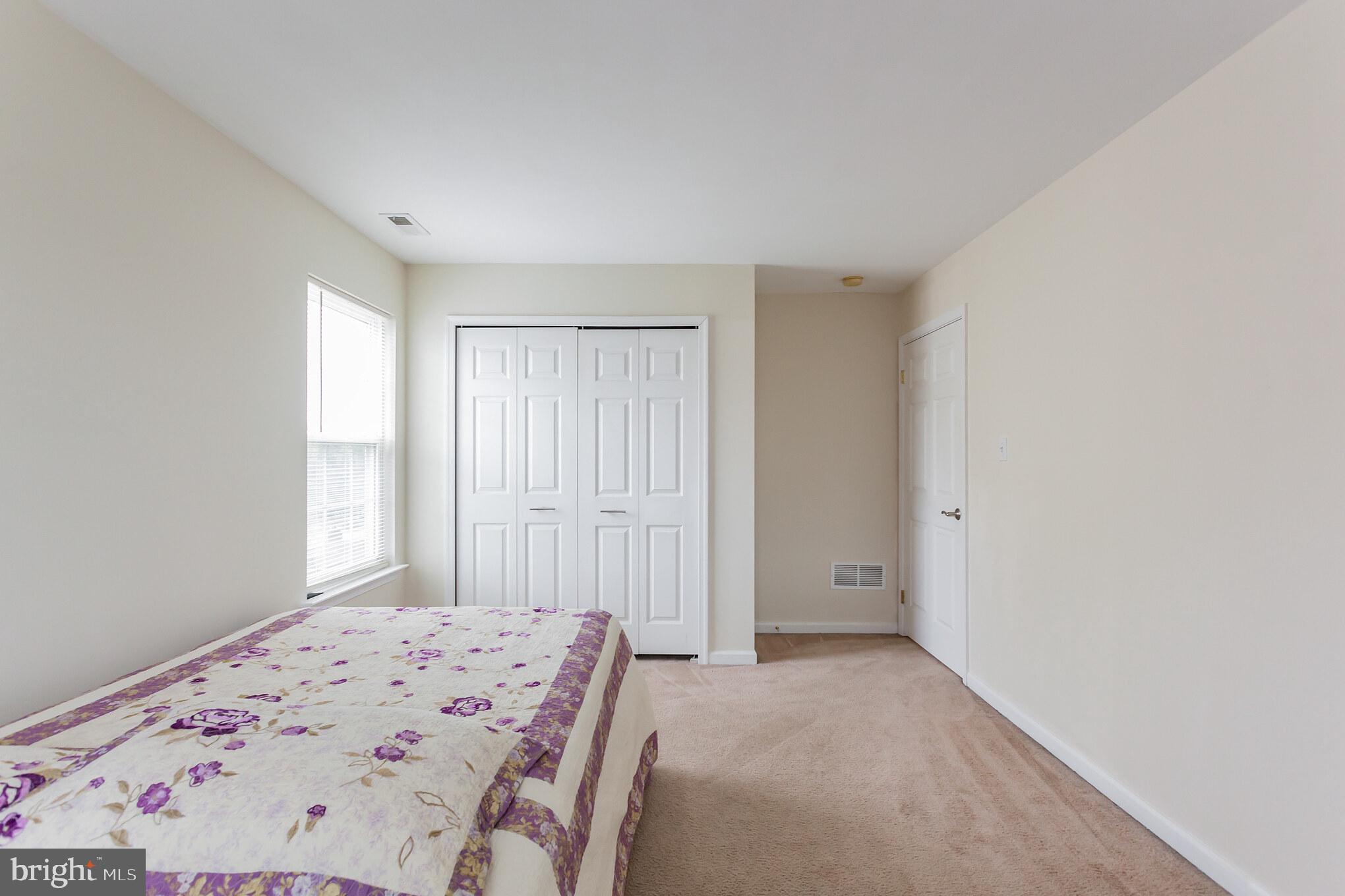 9428 Krewstown Road Philadelphia, PA 19115 - Photo 24 of 30 a view of a bedroom with a bed and a window