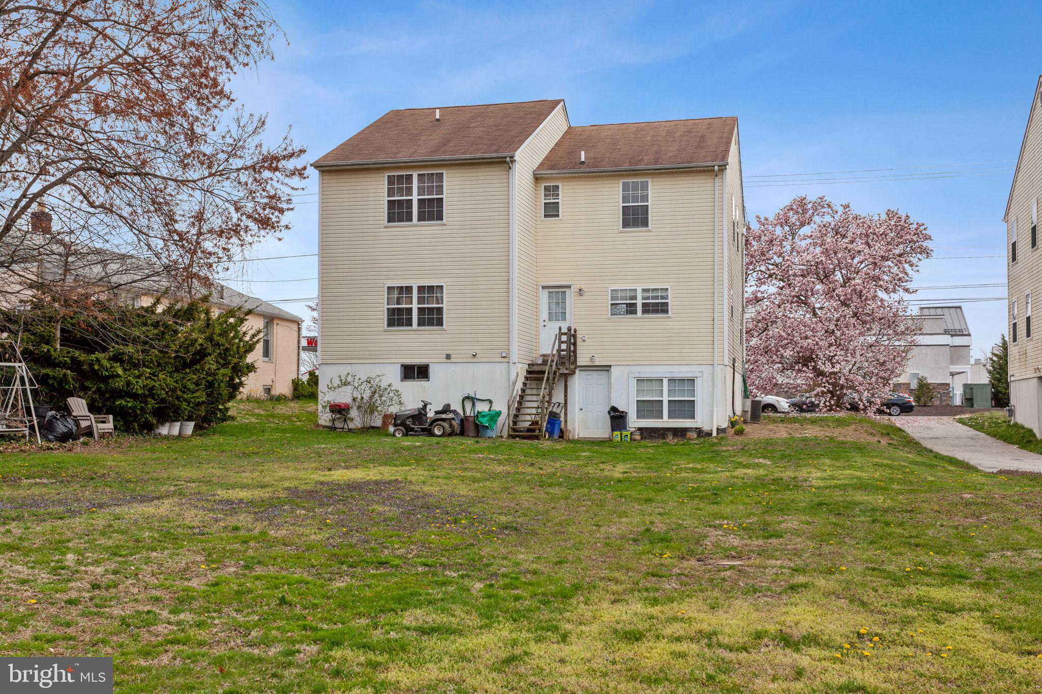 9428 Krewstown Road Philadelphia, PA 19115 - Photo 30 of 30 a view of a house with a big yard and large trees