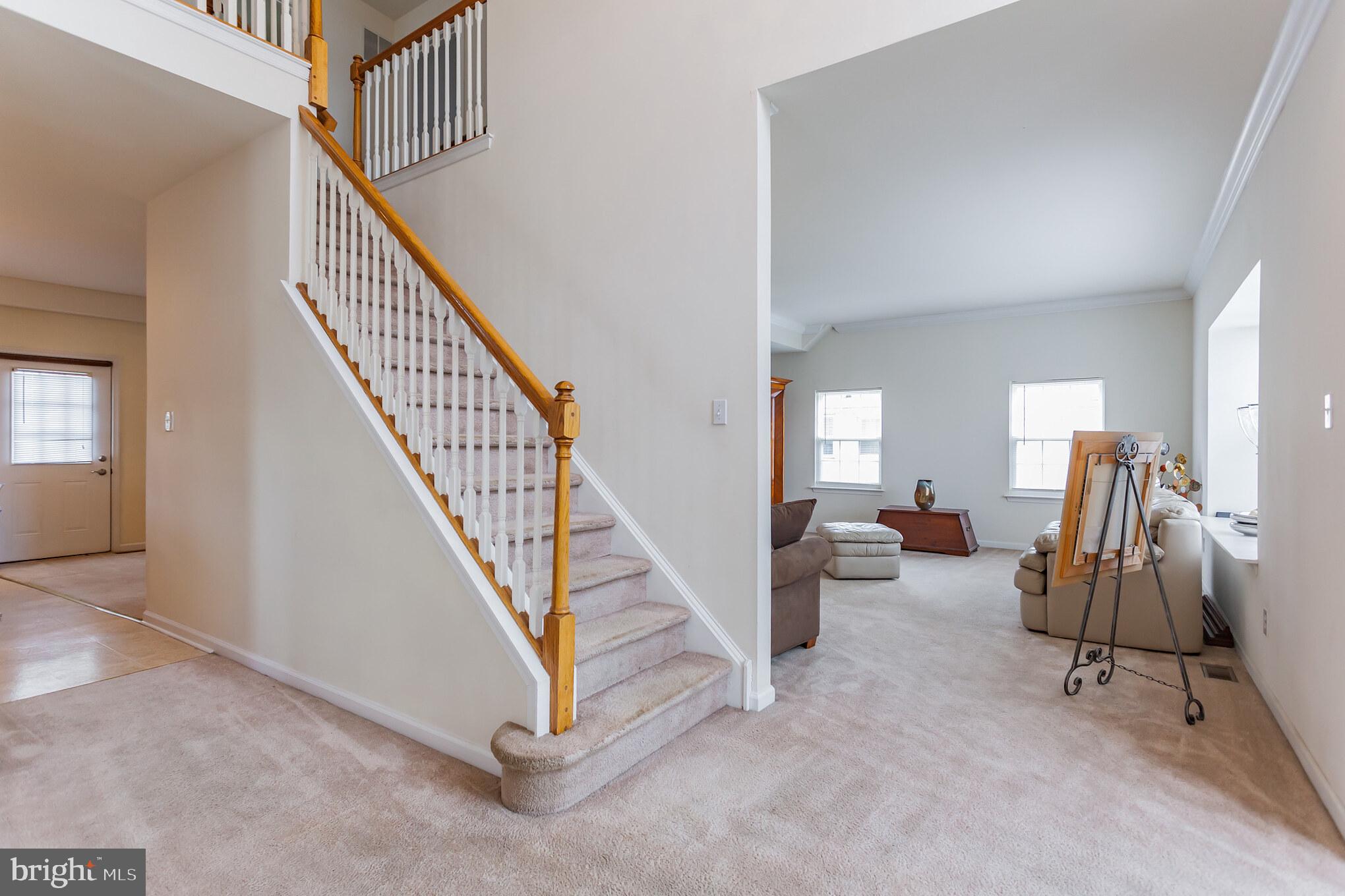 9428 Krewstown Road Philadelphia, PA 19115 - Photo 4 of 30 a view of a livingroom with furniture and staircase