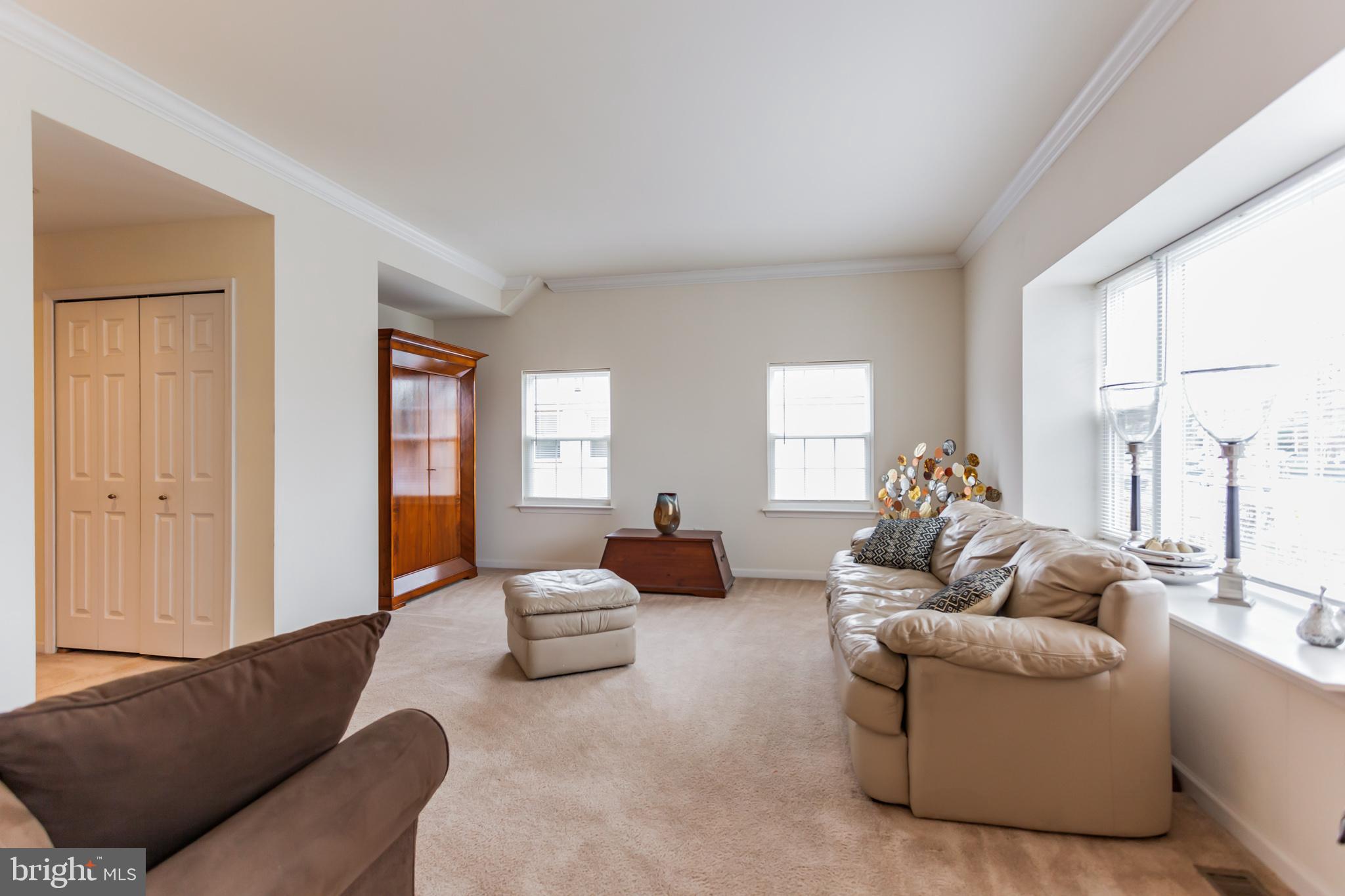 9428 Krewstown Road Philadelphia, PA 19115 - Photo 7 of 30 a living room with furniture and a large window