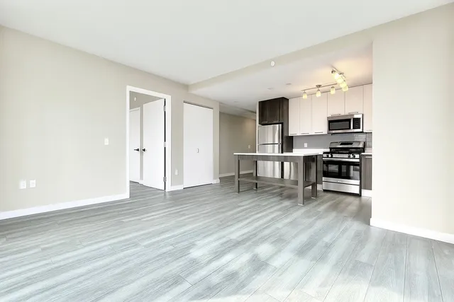 a view of a kitchen with furniture and a window