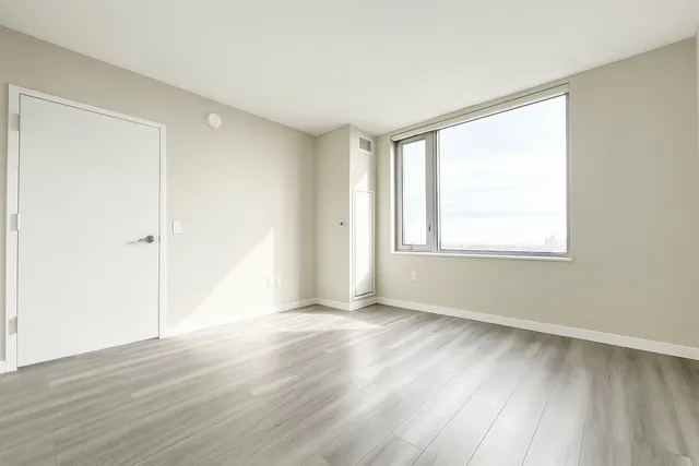 a kitchen with stainless steel appliances a stove a sink and a refrigerator