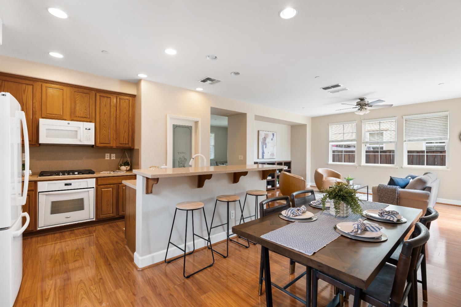 2620 Farmers Central Road Woodland, CA 95776 - Photo 12 of 32 a open dining room with stainless steel appliances granite countertop a stove top oven a dining table and chairs