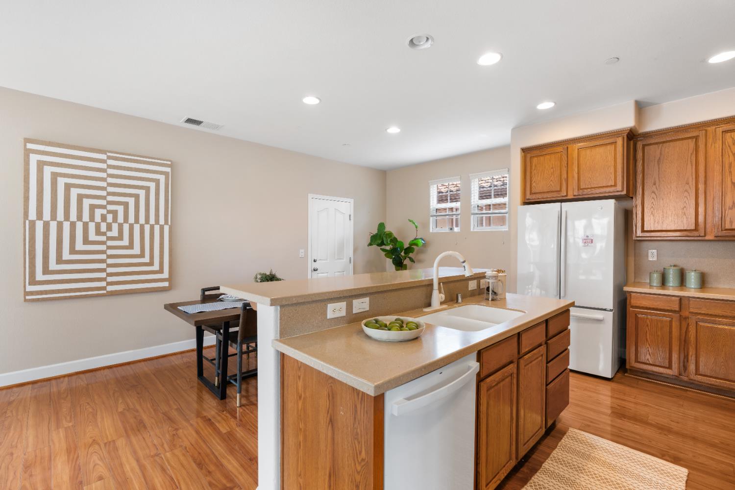 2620 Farmers Central Road Woodland, CA 95776 - Photo 14 of 32 a kitchen with sink cabinets and wooden floor