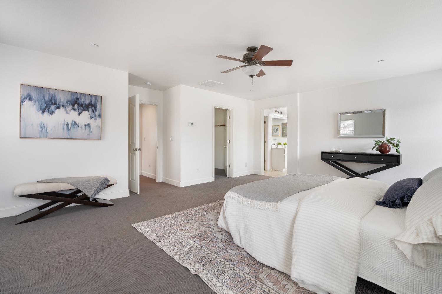 2620 Farmers Central Road Woodland, CA 95776 - Photo 18 of 32 a bedroom with a bed and a chandelier