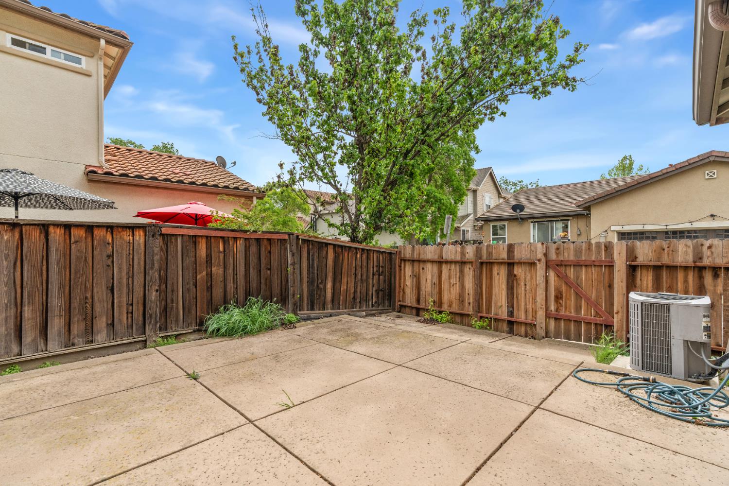 2620 Farmers Central Road Woodland, CA 95776 - Photo 27 of 32 a view of backyard with potted plants and wooden fence
