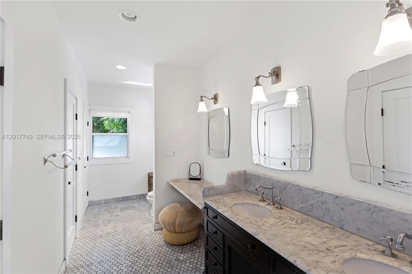 6845 Southwest 98th Street Pinecrest, FL 33156 - Photo 12 of 23 a bathroom with a granite countertop sink and a mirror