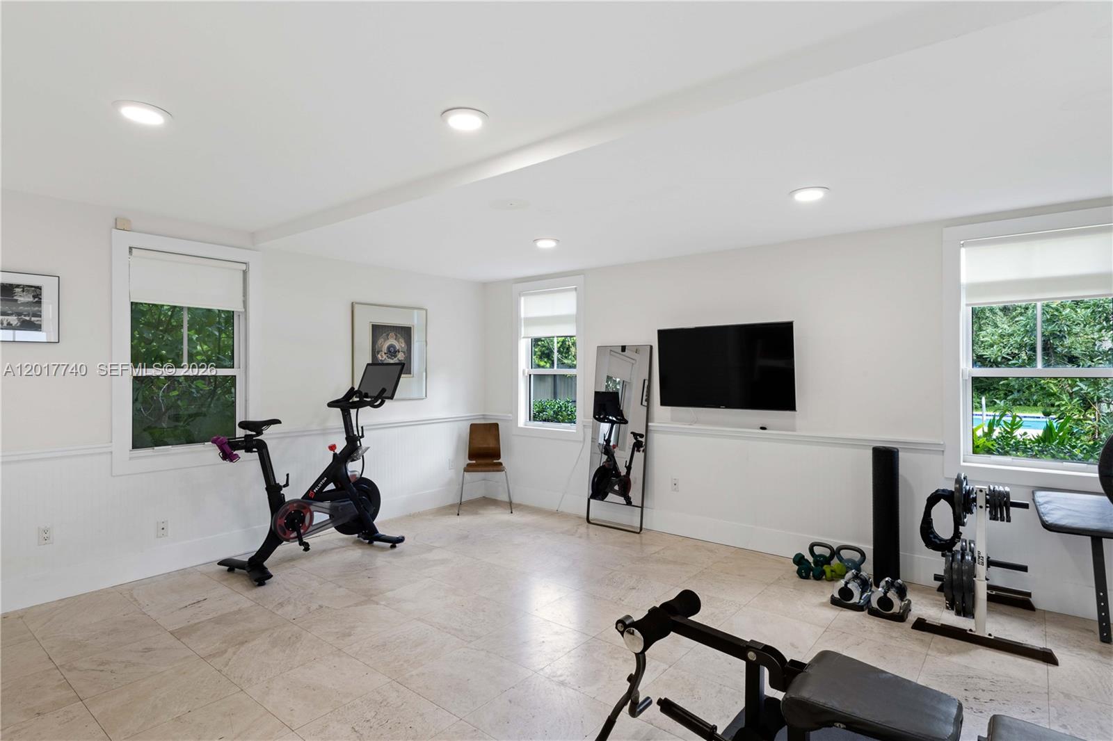 6845 Southwest 98th Street Pinecrest, FL 33156 - Photo 18 of 23 a view of a livingroom with workspace and a window