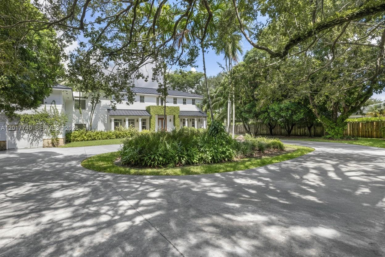 6845 Southwest 98th Street Pinecrest, FL 33156 - Photo 23 of 23 a view of a house with a yard