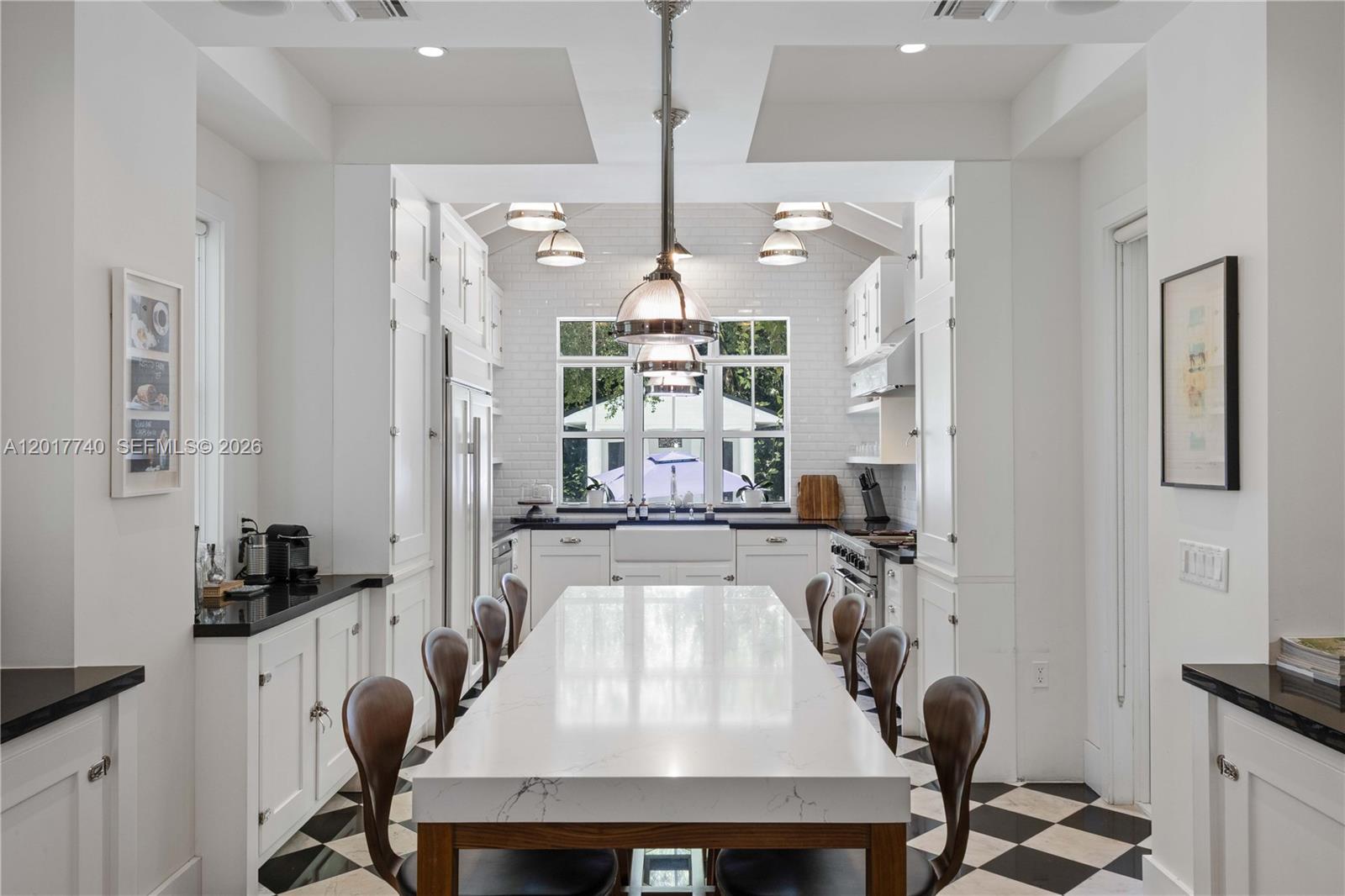 6845 Southwest 98th Street Pinecrest, FL 33156 - Photo 4 of 23 a view of a dining room with furniture and chandelier