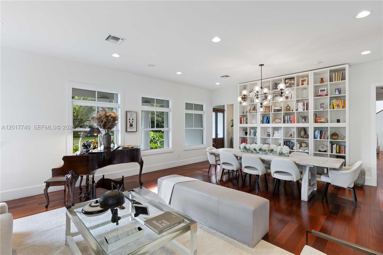 6845 Southwest 98th Street Pinecrest, FL 33156 - Photo 6 of 23 a living room with furniture and a large window