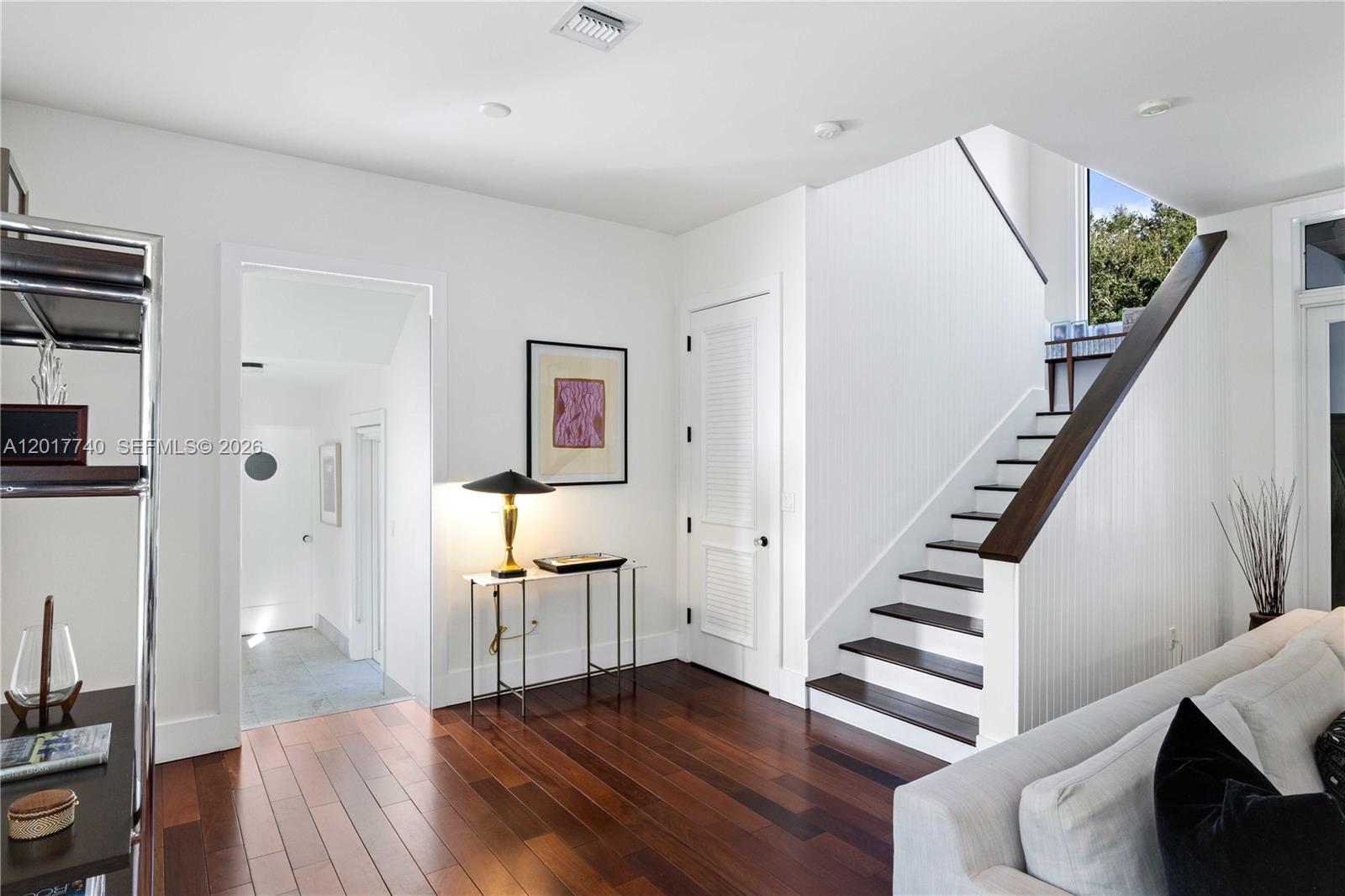 6845 Southwest 98th Street Pinecrest, FL 33156 - Photo 10 of 23 a view of entryway with wooden floor and stairs