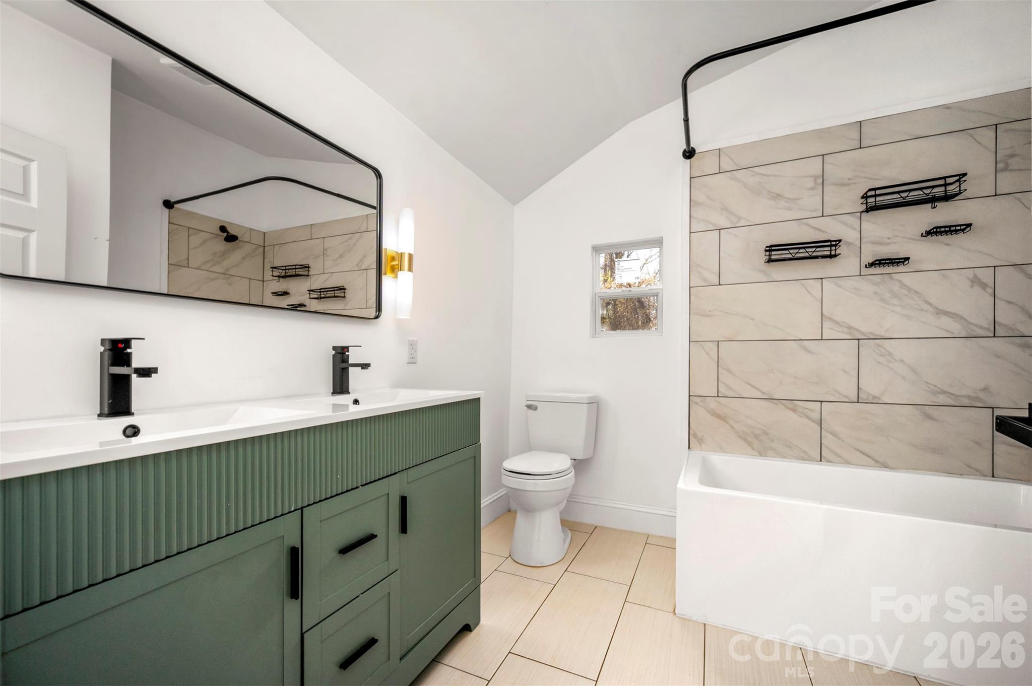 162 Miller Street Spindale, NC 28160 - Photo 12 of 27 a bathroom with a bathtub shower sink mirror and toilet