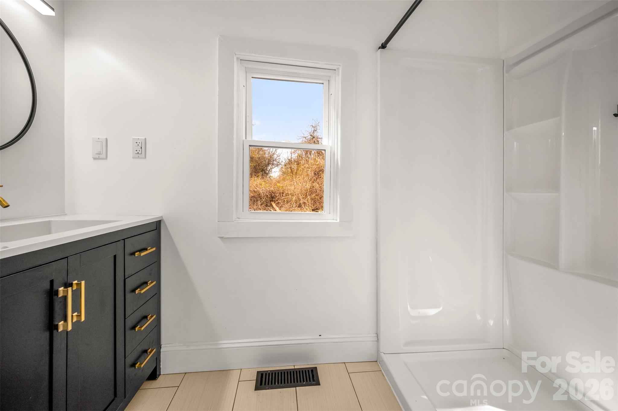 162 Miller Street Spindale, NC 28160 - Photo 17 of 27 a bathroom with a sink and a mirror