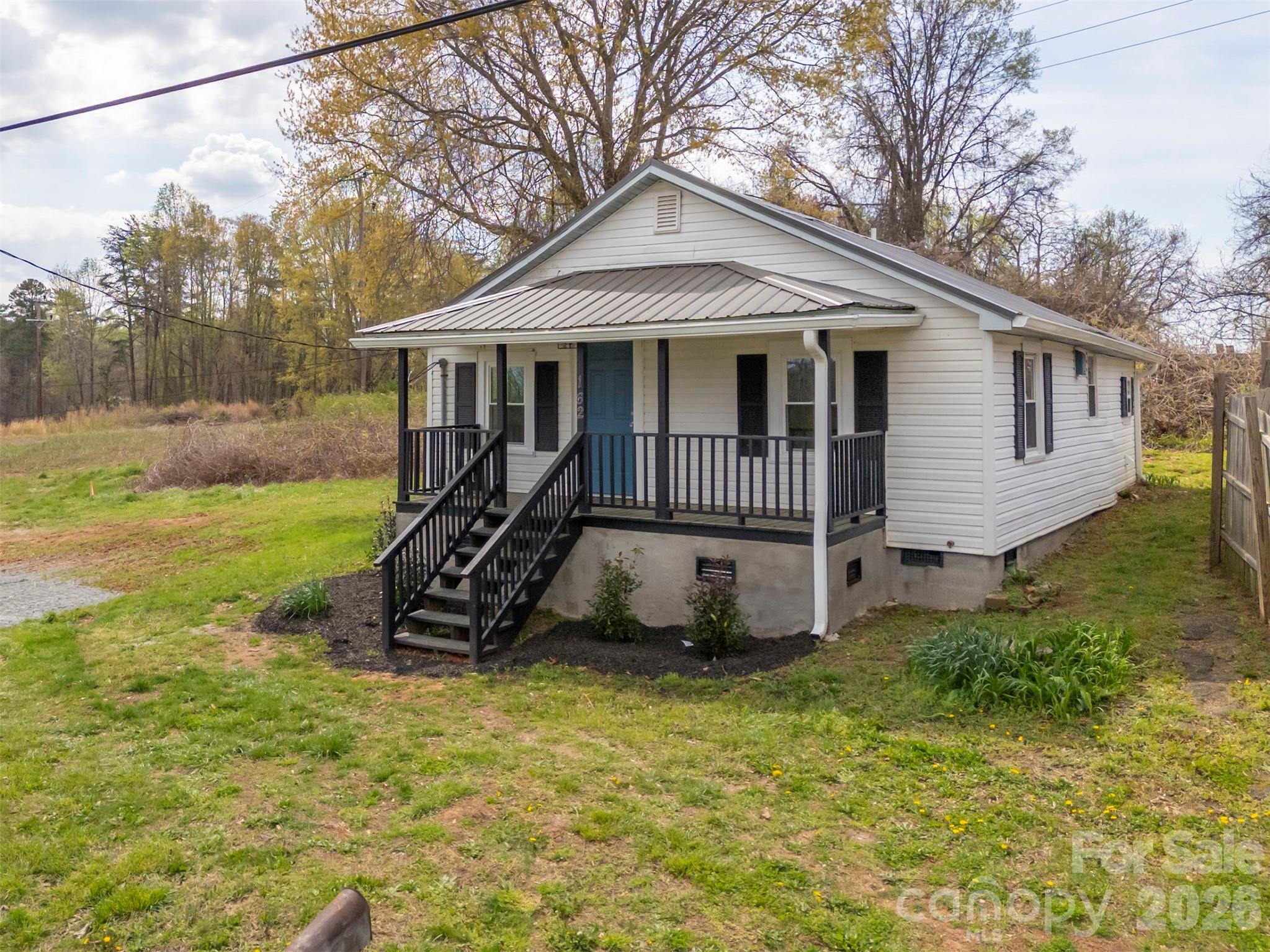 162 Miller Street Spindale, NC 28160 - Photo 2 of 27 a view of a house with a yard