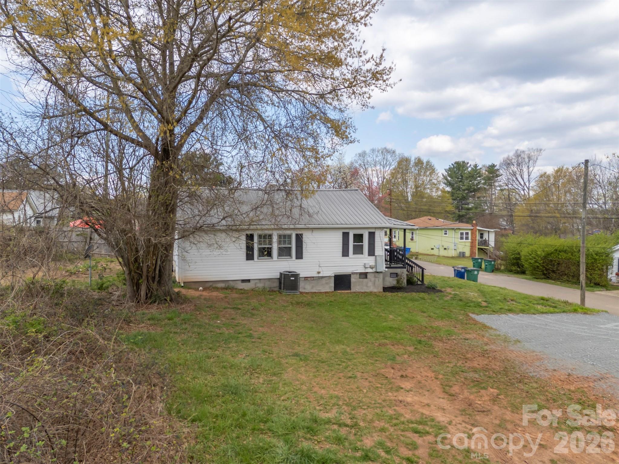 162 Miller Street Spindale, NC 28160 - Photo 26 of 27 a view of a house with a big yard and large trees