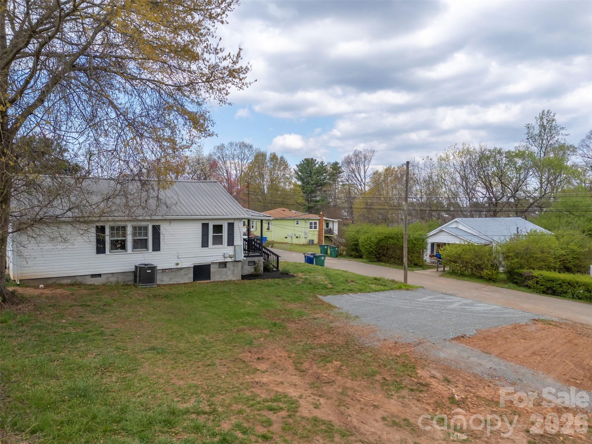 162 Miller Street Spindale, NC 28160 - Photo 27 of 27 a view of a house with a big yard and large trees