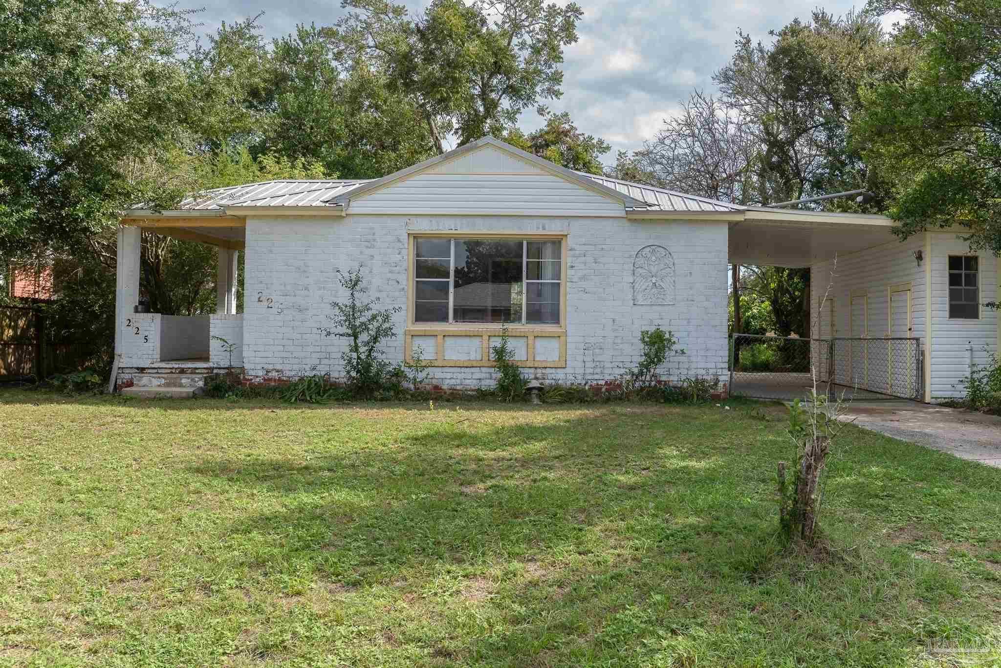 front view of a house with a yard