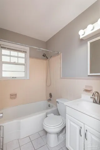 a bathroom with a sink a mirror and a toilet