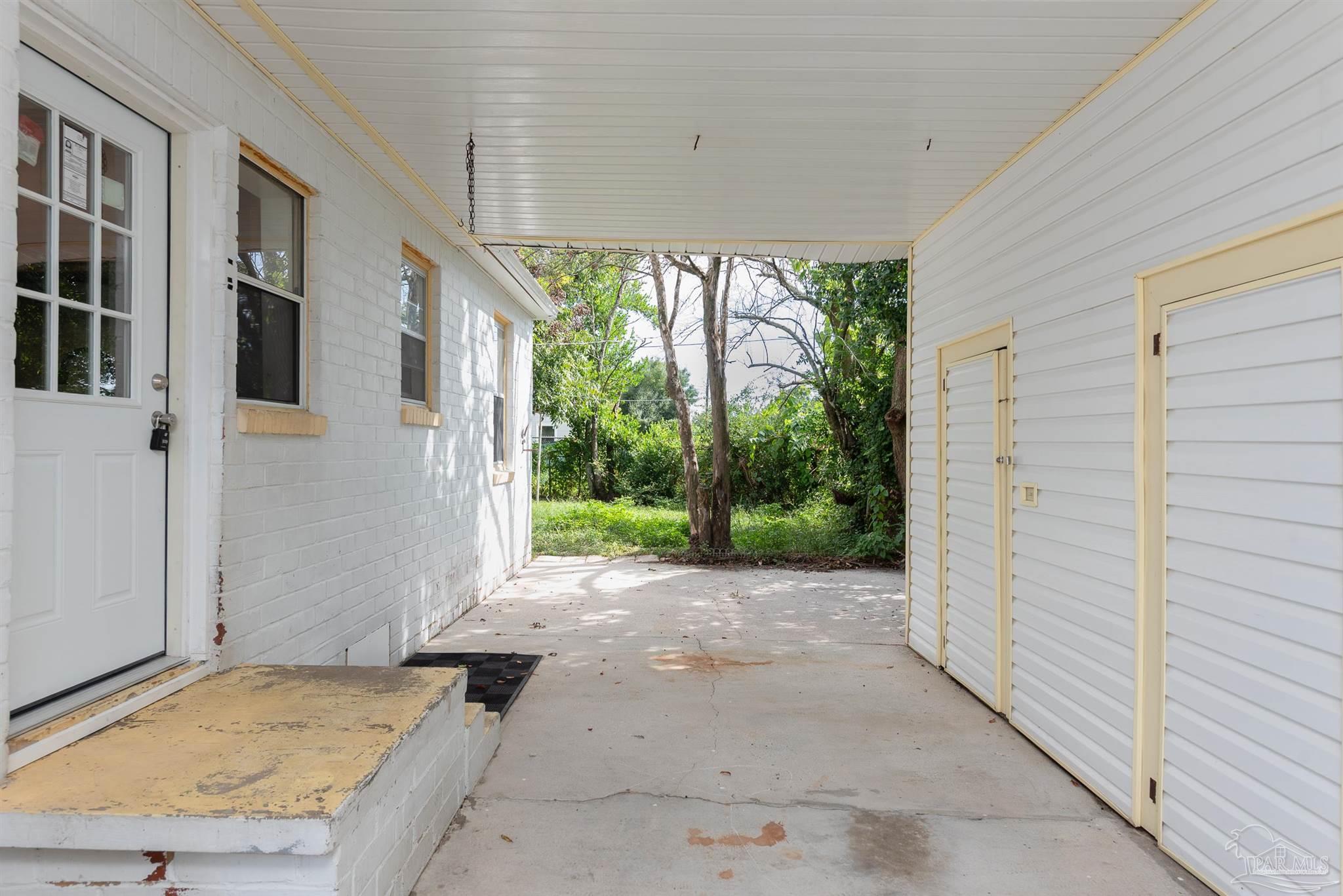 225 Bryant Road Pensacola, FL 32507 - Photo 18 of 21 a view of a house with a backyard
