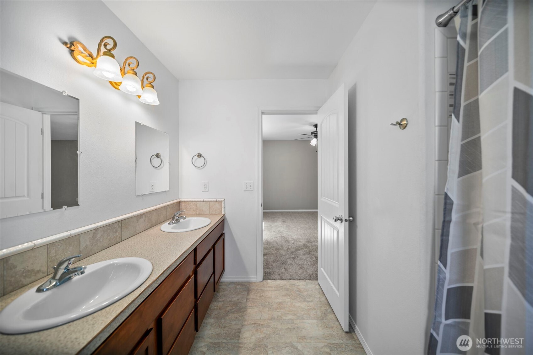 6132 Entiat River Road Entiat, WA 98822 - Photo 22 of 40 a en suite bathroom with a double vanity sink and a mirror