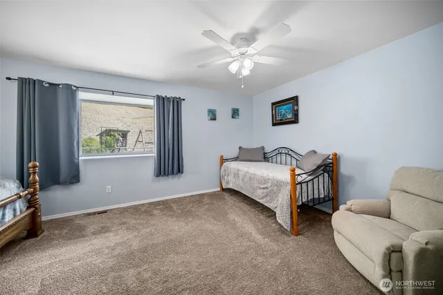 a living room with furniture and white walls