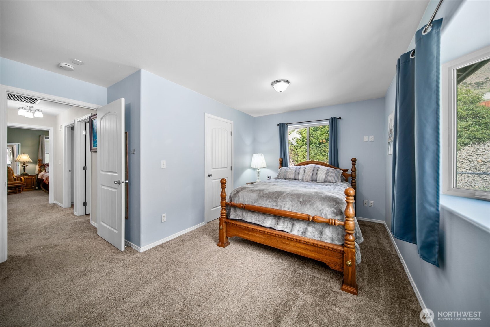 6132 Entiat River Road Entiat, WA 98822 - Photo 27 of 40 a bedroom with a bed and a window