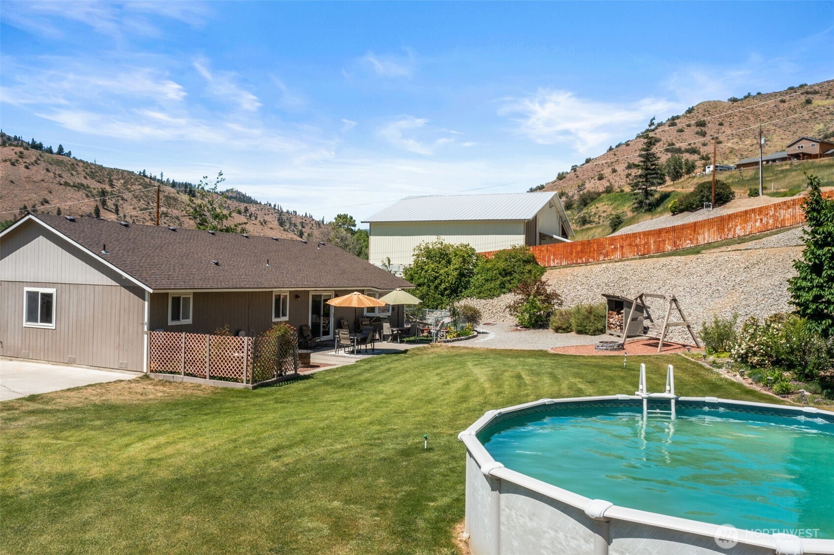 6132 Entiat River Road Entiat, WA 98822 - Photo 36 of 40 a view of a house with a backyard
