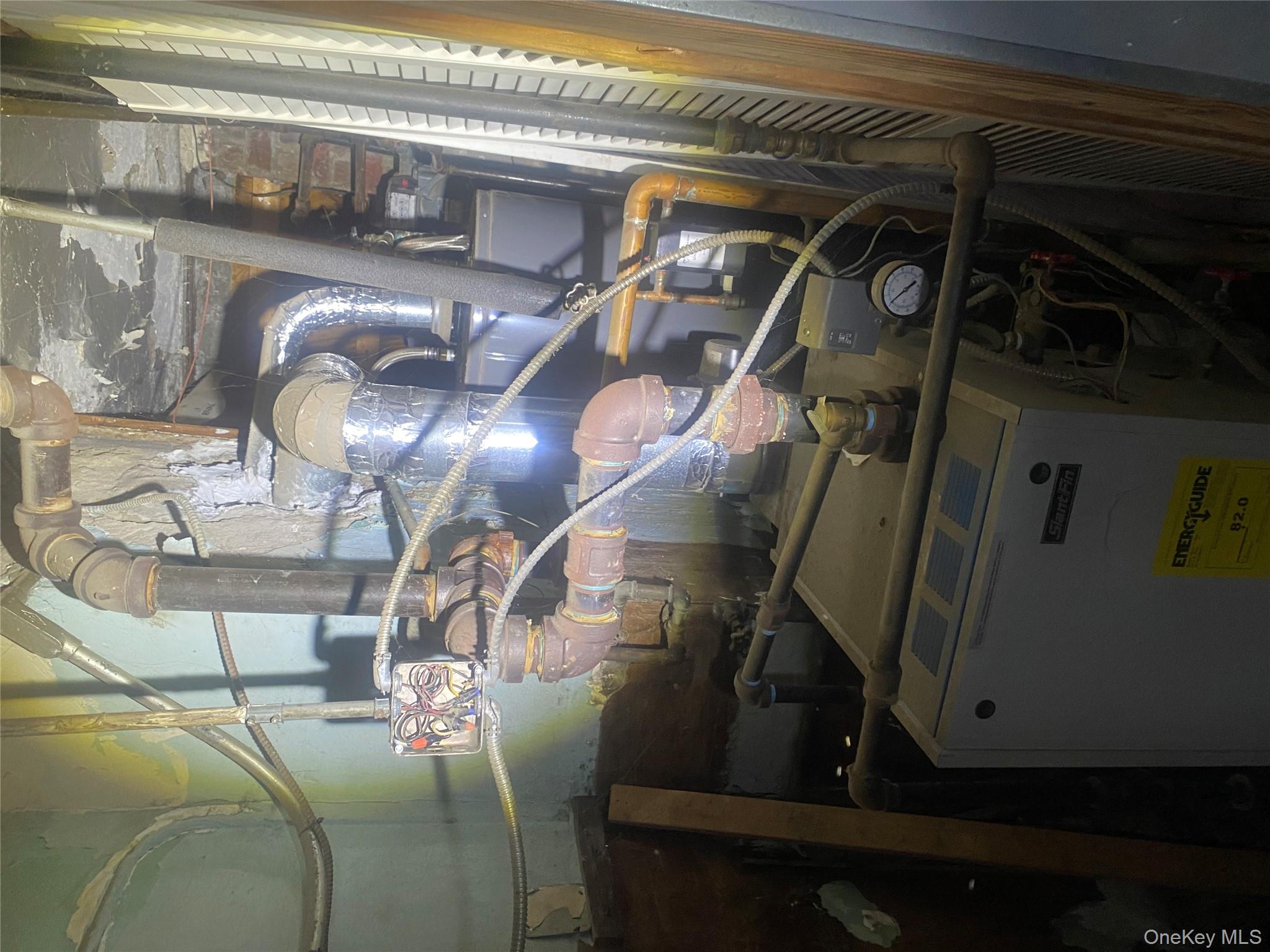 2713 Eastchester Road Bronx, NY 10469 - Photo 7 of 13 a close view of water heater room