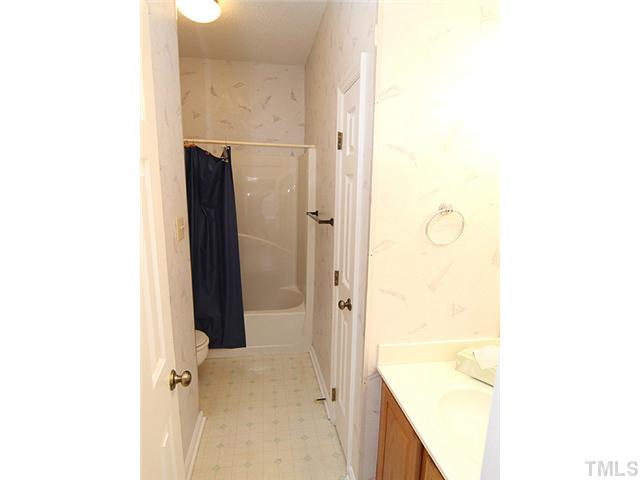 4475 Still Pines Drive Raleigh, NC 27613 - Photo 8 of 12 a bathroom with a shower and a sink