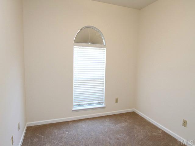 4475 Still Pines Drive Raleigh, NC 27613 - Photo 9 of 12 an empty room with a window
