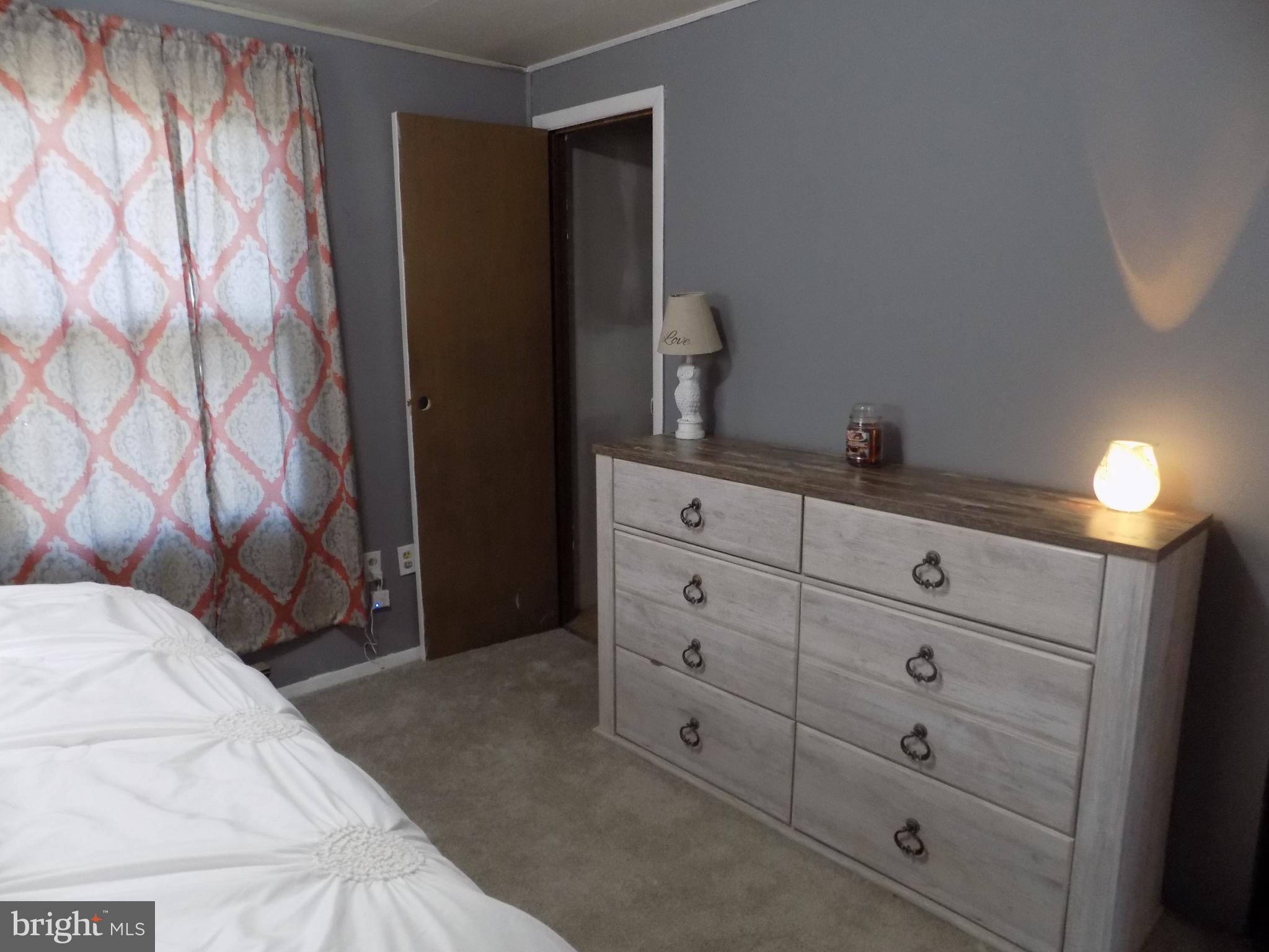 1349 Zook Road Atglen, PA 19310 - Photo 14 of 22 a bedroom with a bed and a lamp on the dresser