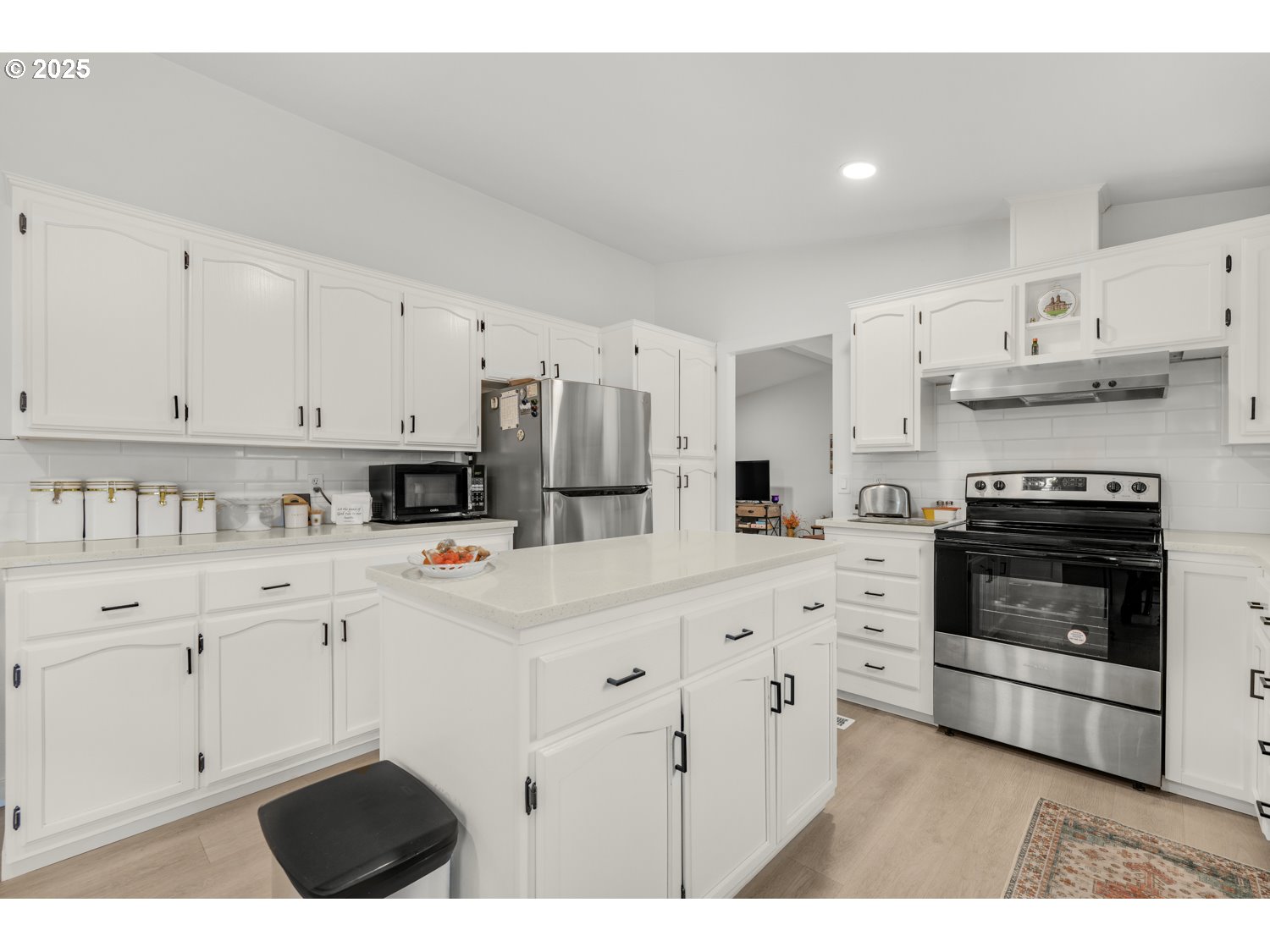 18780 South Central Point Road, Unit 19 Oregon City, OR 97045 - Photo 12 of 25 a kitchen with white cabinets and white appliances