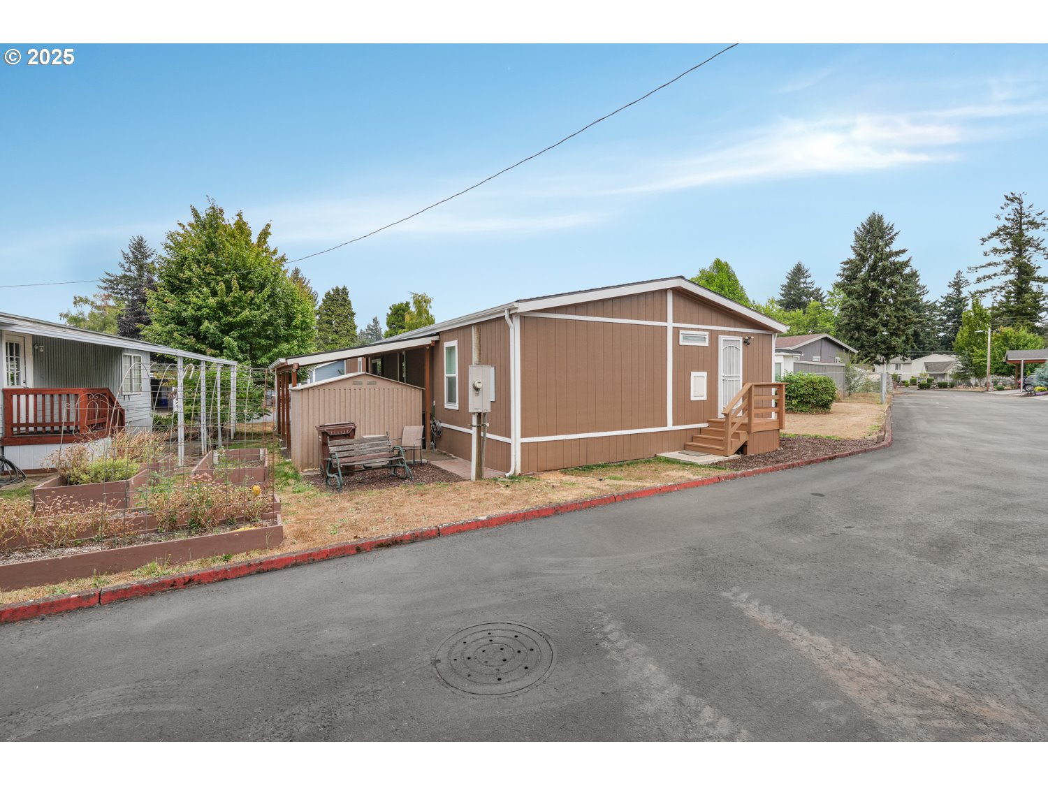 18780 South Central Point Road, Unit 19 Oregon City, OR 97045 - Photo 18 of 25 a view of a house with backyard and bushes
