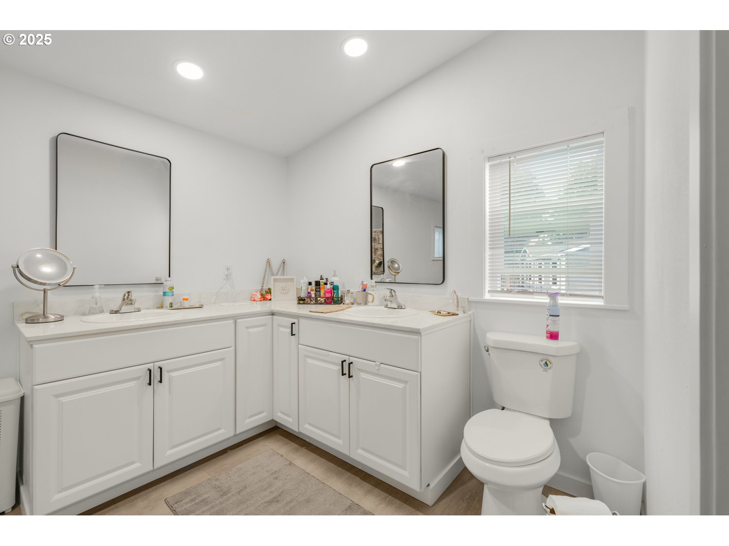 18780 South Central Point Road, Unit 19 Oregon City, OR 97045 - Photo 20 of 25 a bathroom with a toilet a sink a mirror a window and vanity