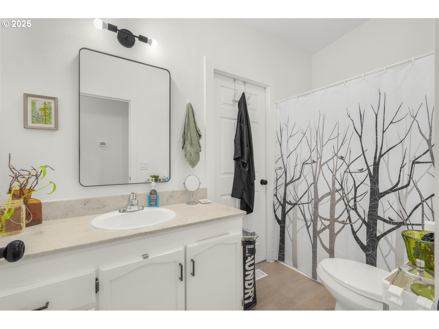 18780 South Central Point Road, Unit 19 Oregon City, OR 97045 - Photo 23 of 25 a bathroom with a sink vanity and a mirror